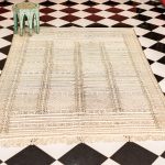 Artisanal Symphony: Vibrant Moroccan Wool Rug from the Atlas Tapestry